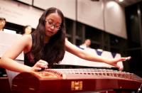 College student Miss Ella Liu giving a Chinese zither performance at the HIgh Table Dinner